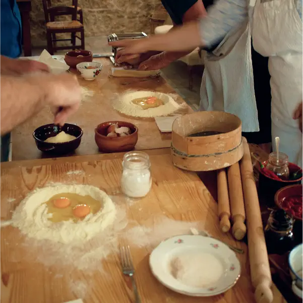 Cooking class making fresh pasta during an Italy bike tour
